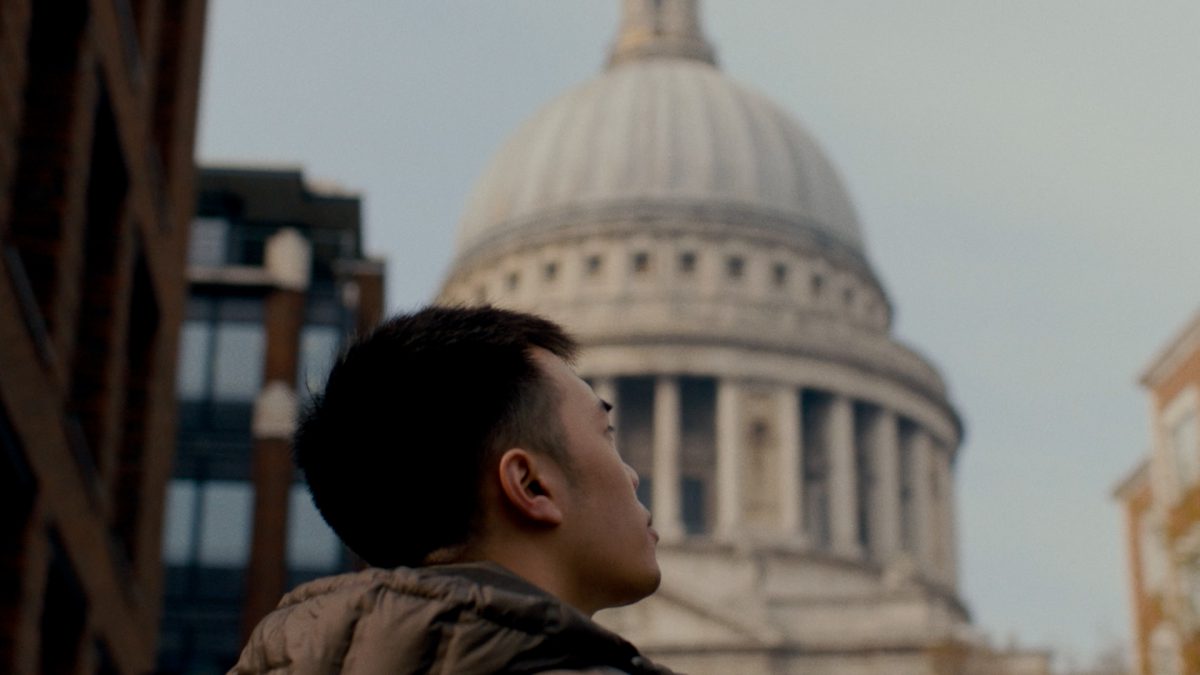 City of London University - A young man looks out over the city of London